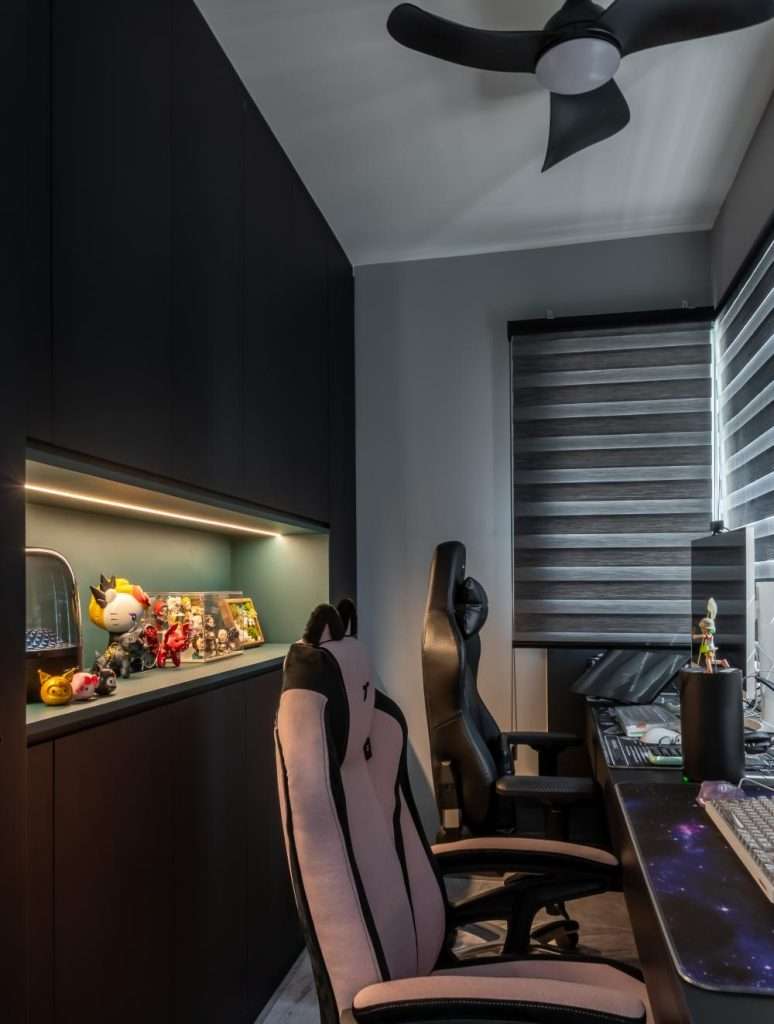 Modern Luxury Interior Design Ideas for HDB Homes in Singapore 5 Dedicated gaming area with dark modern finishes